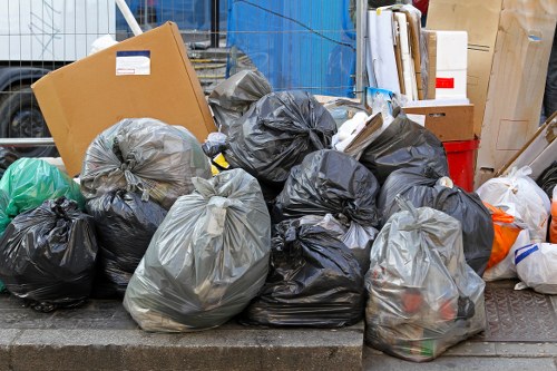 Professional waste clearance team removing construction materials